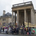 A Welcoming Party from the Local Tibetan Community Brave the Rain outside of Rhodes House. Photograph by Keiko Ikeuchi.